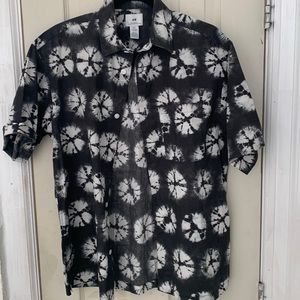 black dress shirt splotched with white patterns